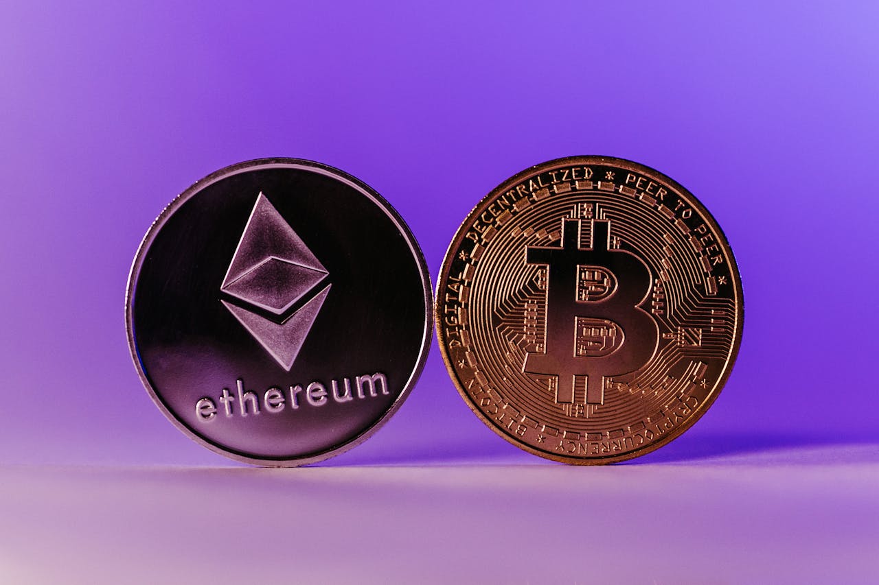 services-04 Close-up of Ethereum and Bitcoin coins symbolizing cryptocurrency and blockchain technology against a purple backdrop.