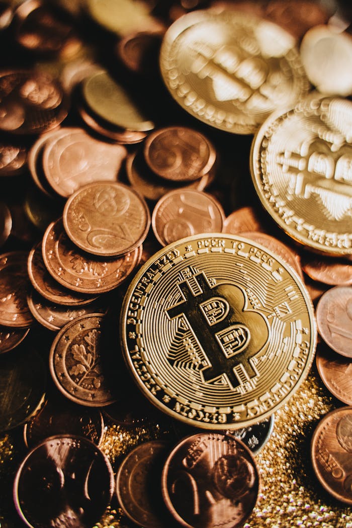 who-we-are Close-up of shiny Bitcoin among assorted coins symbolizing wealth and digital currency.